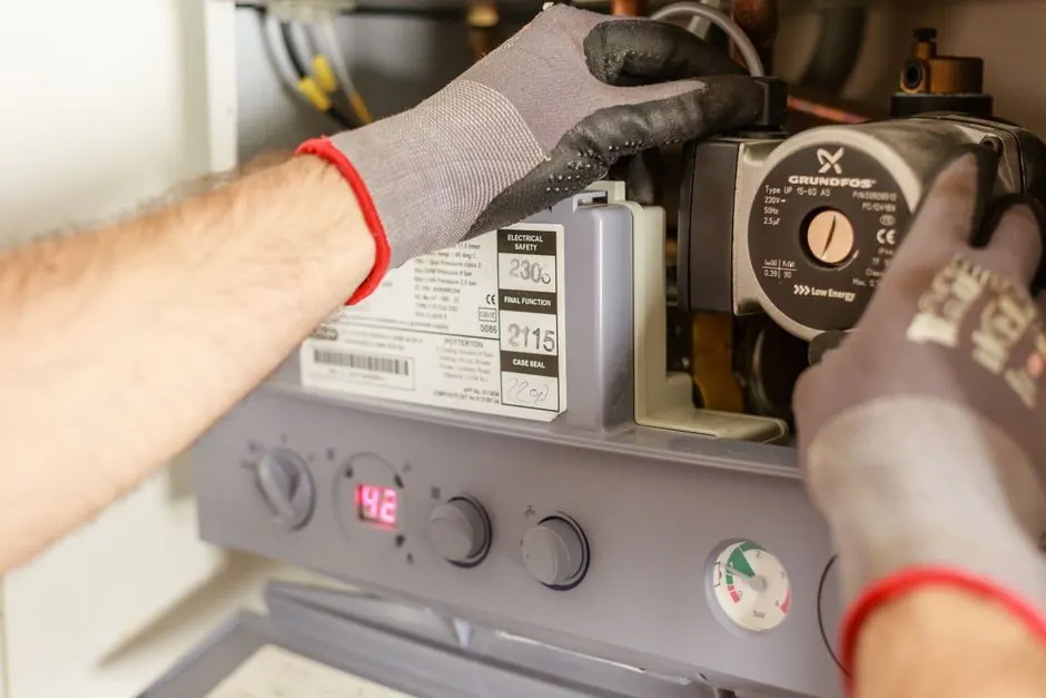 Technician performing drain cleaning on piping inside a Bedford, Texas home.